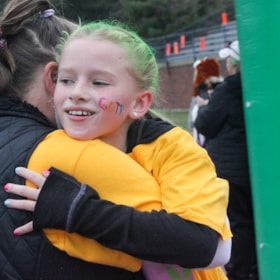 Smiling Girls on the Run coach and participant